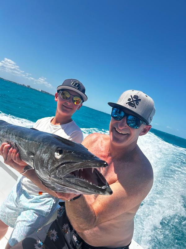 Fisherman with a barracuda near Isla Mujeres
