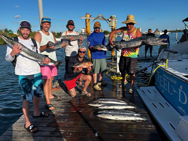 Group of anglers with multiple catches on deck